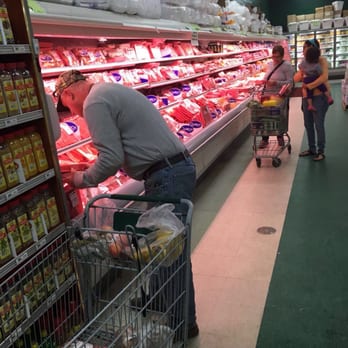 Fancy Fruit Produce And Meat - a man pushing a shopping cart - Fruits & Veggies Near Me - Orange City, Florida