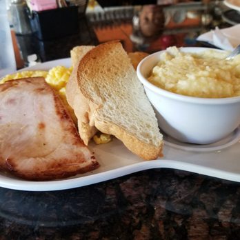 Two Chicks Cafe - Eggs, turkey slice, cheese grits and toast - Breakfast & Brunch Near Me - New Orleans, Louisiana Two Chicks Cafe - Eggs, turkey slice, cheese grits and toast - Breakfast & Brunch Near Me - New Orleans, Louisiana