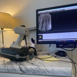 Susan M. Dennis, DDS - They use a little hand held device to take X-rays.