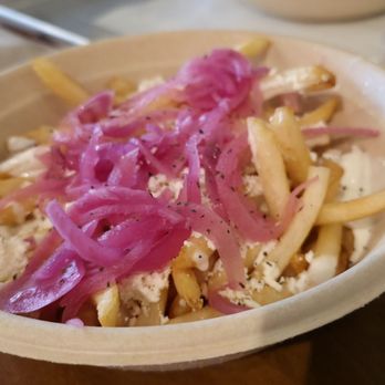 The Kebab Shop - Fries in feta, some OG sauce, and pickled onions. Simple, did not take away from main dish but grear flavor and texture! - Mediterranean Near Me - Houston, Texas
