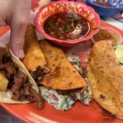 El Ranchero Authentic Mexican Cuisine - Burria tacos and one of my husband's al pastor tacos.