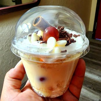 Delícias da Nossa Terra - My favorite dessert I've had there. It's vanilla cake with cream and grapes inside of it. - Brazilian Near Me - Clinton, Massachusetts