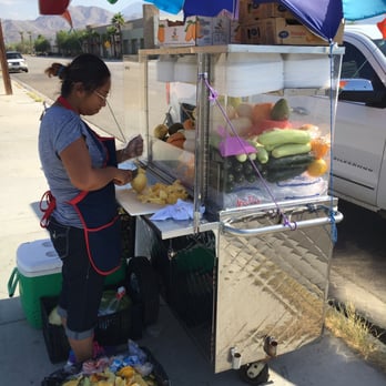 Fruit Lady - Working that knife on the fresh mango. - Fruits & Veggies Near Me - Cathedral City, California Fruit Lady - Working that knife on the fresh mango. - Fruits & Veggies Near Me - Cathedral City, California