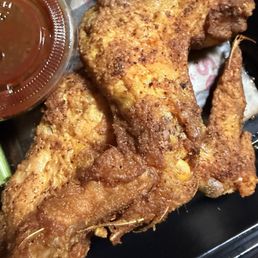 Chicken with feathers still on