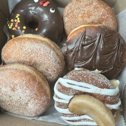 Bottom left to bottom Right 2 apple pie donuts Turkey special Apple pie donut Boston cream Apple cider donut Bottom left to bottom Right 2 apple pie donuts Turkey special Apple pie donut Boston cream Apple cider donut