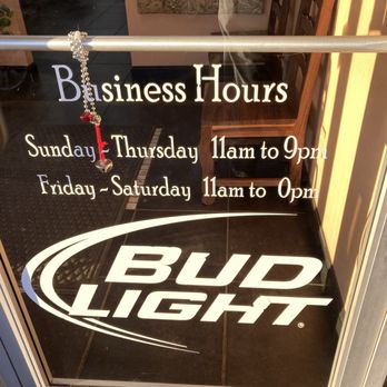 Ameca Mexican Restaurant - hours of operation posted on front door - Mexican Near Me - Marianna, Arkansas