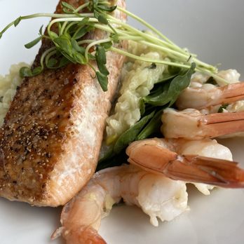 The Raven Bistro - Salmon with prawns and garlic risotto. The only downside was the salmon was over cooked. But overall a great dish. - Mediterranean Near Me - Jasper, Alberta The Raven Bistro - Salmon with prawns and garlic risotto. The only downside was the salmon was over cooked. But overall a great dish. - Mediterranean Near Me - Jasper, Alberta