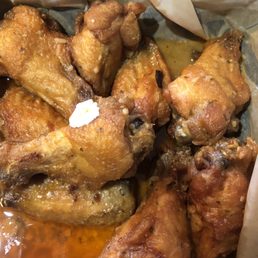 Wings soaked in Mild Buffalo & Garlic Parm sauce mix