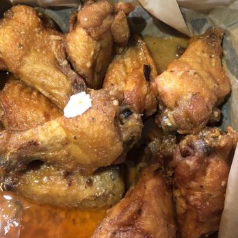 Hook and Eagle Tavern - Wings soaked in Mild Buffalo & Garlic Parm sauce mix - Cocktail Bars Near Me - Rockledge, Florida