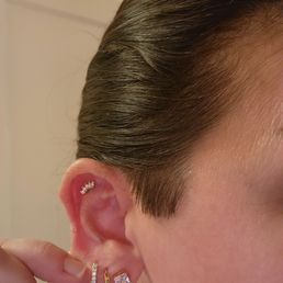 New flat helix piercing. I previously got my third hole piercing at a Studs location as well.