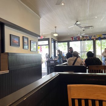 Doc's Marina Grill - My table and "the wall" where people were waiting and complaining about the wait to use the toilet. - American Near Me - Bainbridge Island, Washington Doc's Marina Grill - My table and "the wall" where people were waiting and complaining about the wait to use the toilet. - American Near Me - Bainbridge Island, Washington