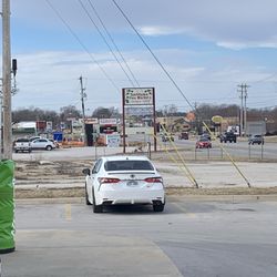 Plaza Tire Service - Antiques to the west