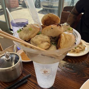 Shanghai Tapas - 6. Mini Pan-Fried Pork Buns (12 pcs) - Shanghainese Near Me - Elk Grove, California Shanghai Tapas - 6. Mini Pan-Fried Pork Buns (12 pcs) - Shanghainese Near Me - Elk Grove, California