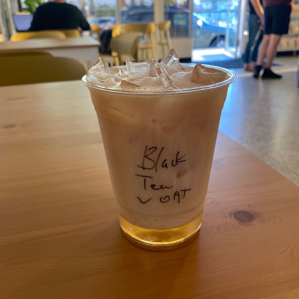 Slow Bloom Coffee - Black Tea "Tobacco" with oat milk - Coffee & Tea Near Me - Redlands, California Slow Bloom Coffee - Black Tea "Tobacco" with oat milk - Coffee & Tea Near Me - Redlands, California
