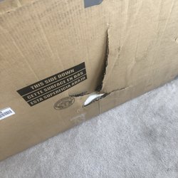 UPS Customer Center - This is the table that got delivered by UPS driver ..desk with glass top from costco