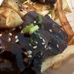 Kalbi plate perfectly cooked and flavored with fries n slaw - sister loved it Kalbi plate perfectly cooked and flavored with fries n slaw - sister loved it