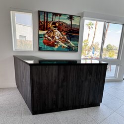 Lazaro Custom Woodworks - Stunning piano black top and cabinets to match kitchen cabinets.