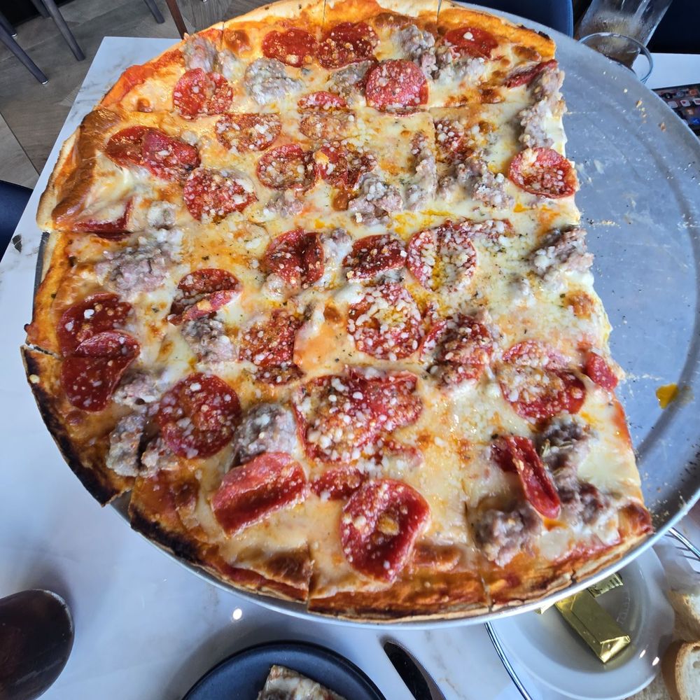 Sausage and pepperoni pizza. Sausage and pepperoni pizza.