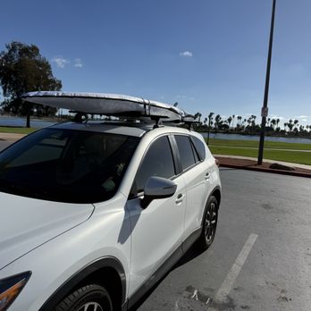 Affordable Stand Up Paddleboards - My paddleboard with its cover on top of my car - Paddleboarding Near Me - Dana Point, California