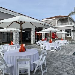 Hector's Magical Party Rentals - umbrella tables