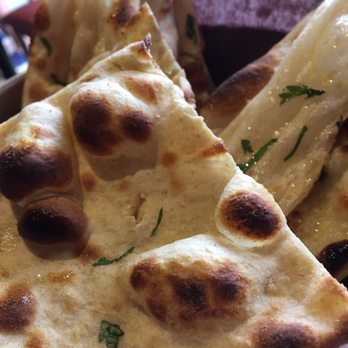 Pukka - Their break basket with plain naan, garlic naan, and roti. - Indian Near Me - Toronto, Ontario