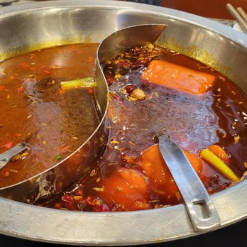 Liuyishou Hotpot - Left side:beef base soup Right sd: house spicy soup - Chinese Near Me - Chicago, Illinois