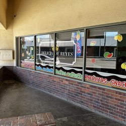 Delicia de Reyes - Outside of store