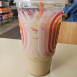 Cremer not milk and I highly doubt they added the shot of espresso. Also they just dumped ice into a hot coffee and called it a day.