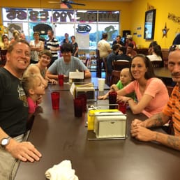a group of people sitting at a table