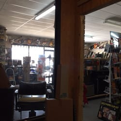 Acoustic and electric guitars, basses, some drums and sound gear. Cool 60's novelty guitars hanging at the top around the store