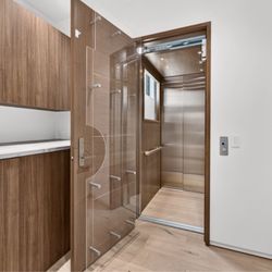 Hankin Specialty Elevators - Cambridge elevating pass through elevator with window