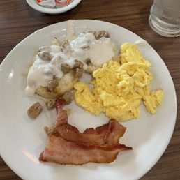 Grand Slam with Sausage Gravy over biscuit, scrambled eggs, bacon and coffee Grand Slam with Sausage Gravy over biscuit, scrambled eggs, bacon and coffee