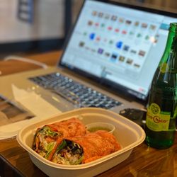 Synergy Fusion Cafe - Getting some work done while enjoying this delicious wrap!!