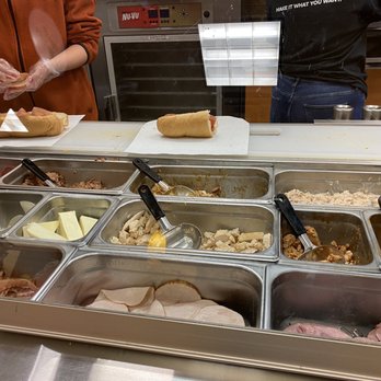Subway - a woman preparing food in a buffet - Sandwiches Near Me - Chesapeake, Virginia Subway - a woman preparing food in a buffet - Sandwiches Near Me - Chesapeake, Virginia