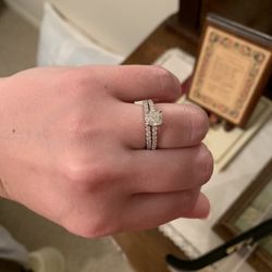Madisonville Jewelers - Cushion-cut one-carat diamond engagement ring with wedding band.