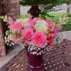 University Flowers & Gifts - Pink snapdragons and roses, white roses, lavender roses and baby's breath.