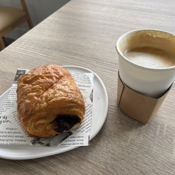 Bancone - chocolate croissant and vanilla latte (a few sips taken) - Coffee & Tea Near Me - Cypress, California Bancone - chocolate croissant and vanilla latte (a few sips taken) - Coffee & Tea Near Me - Cypress, California