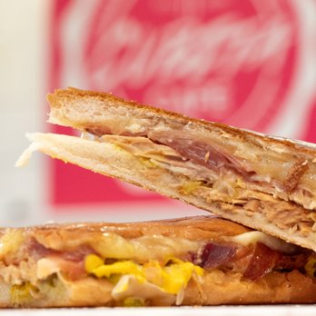 Cubita - two halves of a sandwich on a plate - Cuban Near Me - Nutley, New Jersey Cubita - two halves of a sandwich on a plate - Cuban Near Me - Nutley, New Jersey