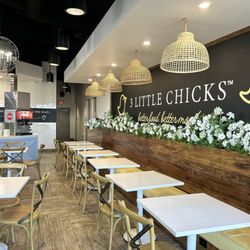 3 Little Chicks - Main entrance cute spring interior decor. pale yellow w pastel blue and white color scheme.