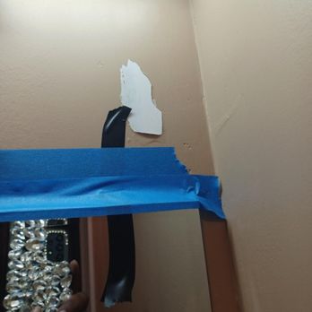 Capital Development - Bathroom mirror 'installed' with glue and starting to slip taking pain with it. - General Contractors Near Me - Kennesaw, Georgia Capital Development - Bathroom mirror 'installed' with glue and starting to slip taking pain with it. - General Contractors Near Me - Kennesaw, Georgia