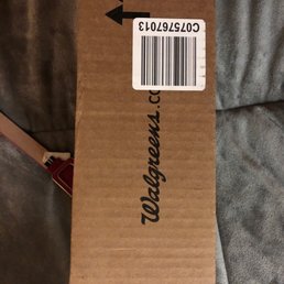 a cardboard box on a bed
