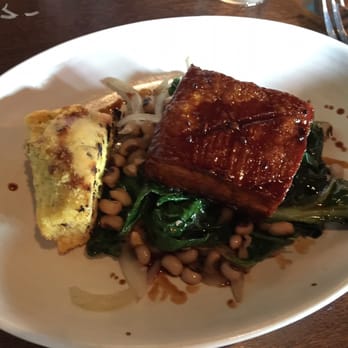 Flying Pig Pub & Kitchen - Pork belly with collard greens - Pubs Near Me - Oceanside, California Flying Pig Pub & Kitchen - Pork belly with collard greens - Pubs Near Me - Oceanside, California