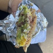 Photo of Mike & Patty's - Boston - Boston, MA, United States. Fancy sandwich slightly eaten so you can see the generous serving of avo