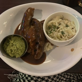 Olde Brick House - Bangers & Mash with creamed peas (the guac looking container) and creamed cabbage (sooooo good!!!!) - Irish Near Me - Rochester, Minnesota Olde Brick House - Bangers & Mash with creamed peas (the guac looking container) and creamed cabbage (sooooo good!!!!) - Irish Near Me - Rochester, Minnesota