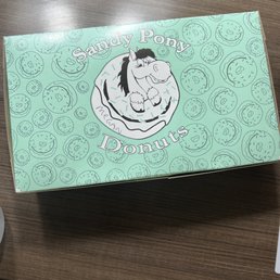 a box of donuts on a table a box of donuts on a table