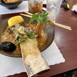Beef short rib Khao Soi. Meat falls off the bone. And the chopsticks are floating in the noodles! Beef short rib Khao Soi. Meat falls off the bone. And the chopsticks are floating in the noodles!