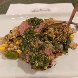 Lollipop lamb chops with three herb pesto.