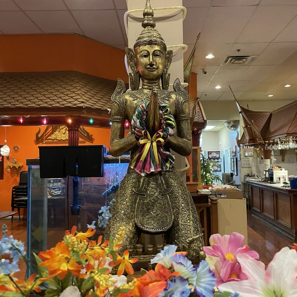 Thai House - a statue of a woman holding a child - Thai Near Me - Las Vegas, Nevada Thai House - a statue of a woman holding a child - Thai Near Me - Las Vegas, Nevada
