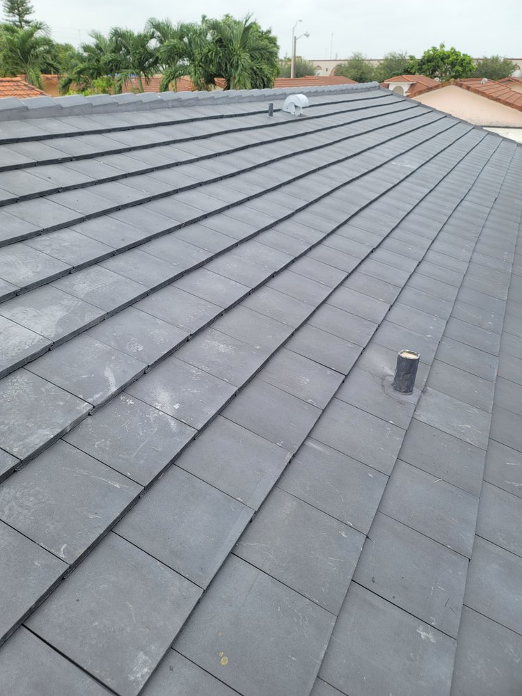 Slide of JMR Roofing Services