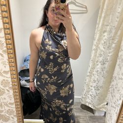 Rochelle's of Newport - Front of black dress with gold floral print.